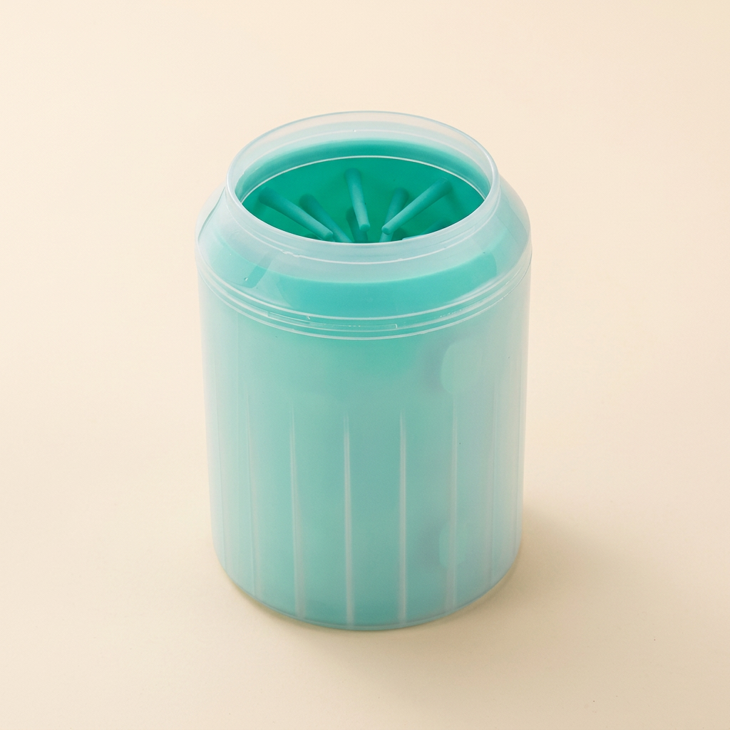 Green silicone dog paw cleaning cup on a cream background